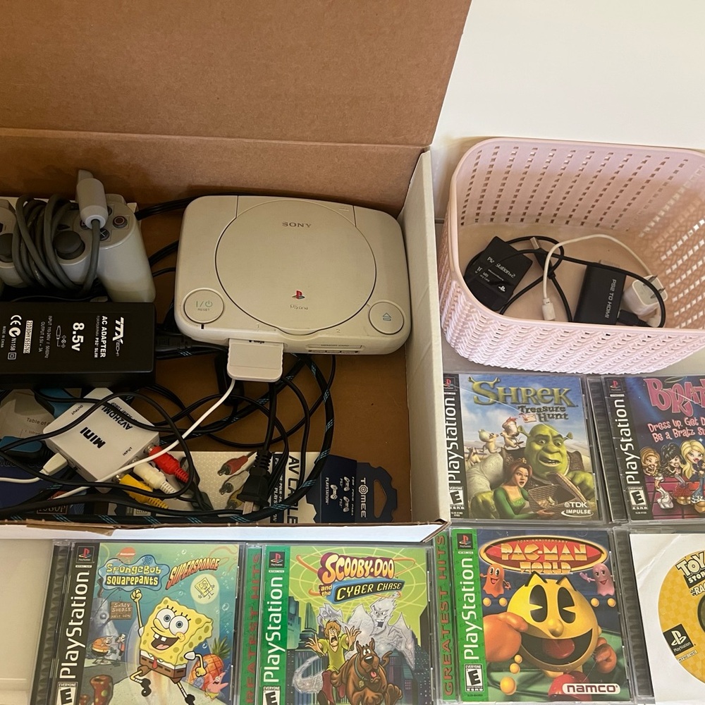 Play station slim with lots of games included